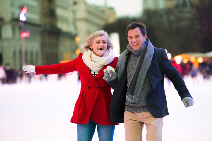 Senior couple ice skating